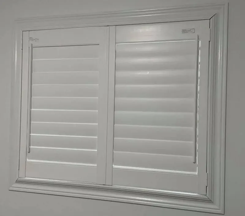 Shutters with louvres closed for privacy